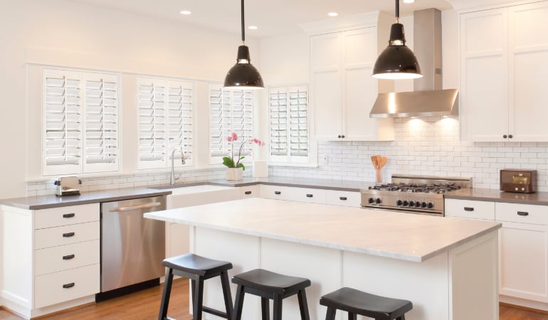 Plantation shutters in a bright Boston kitchen.